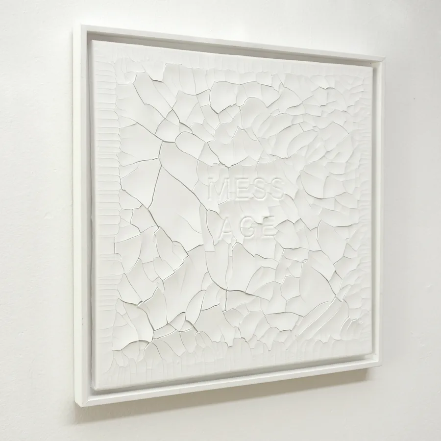 we live in the mess age, the framed work seen from the side