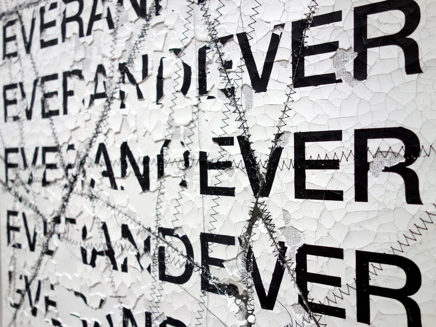 pretending, detail, the stitched cracks behind the words