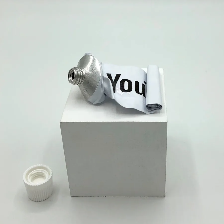 expressed, tube on wooden base, ©2019