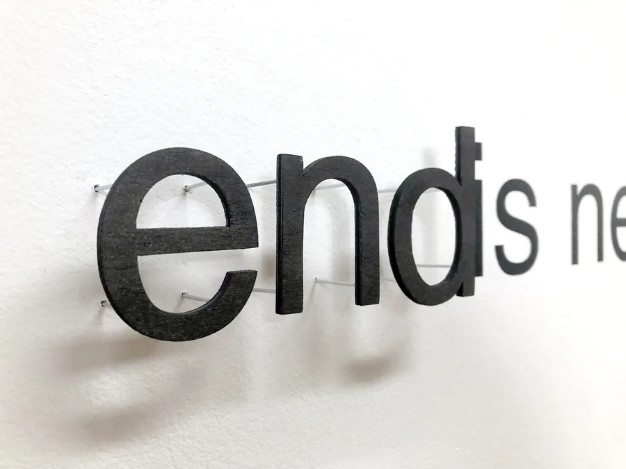 the end is nearer, detail, the letters standing off the wall
