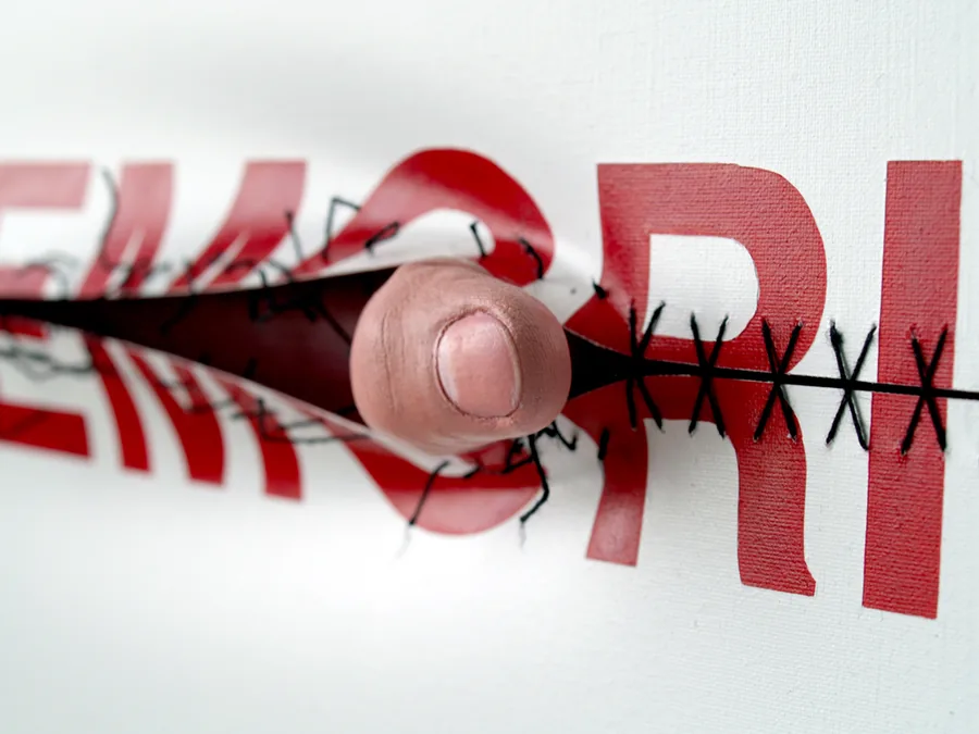 memories, detail, a finger in the stitched slit