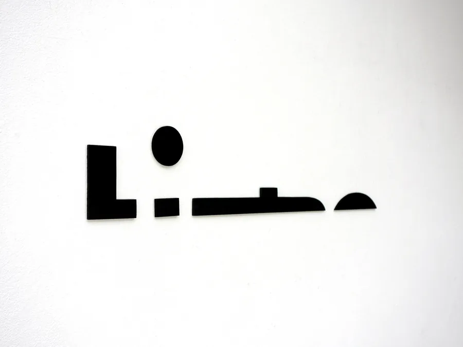 lifetime, detail, the letters slide sideways along the wall