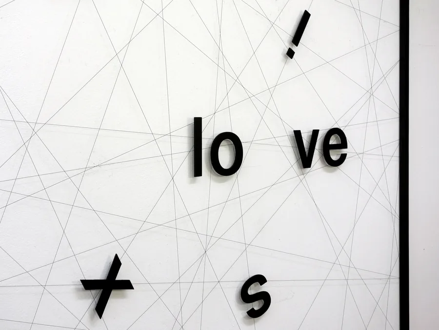 explosive, detail, the letters scattered across the web of lines
