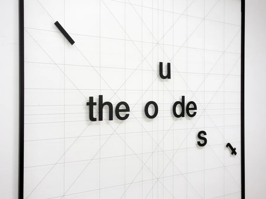 ode, seen from the side, the loose letters on the web of lines
