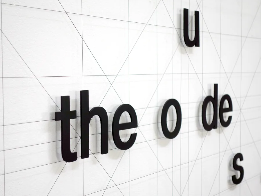 ode, detail, the letters standing off the surface