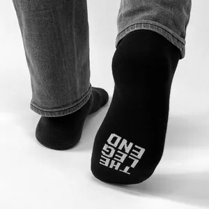 "THE LEG END" socks, 1st edition 2022, , • two sizes:  39-42 (~ US 6-9) and 43-46 (~ US 9,5-12), • text knitted into black business socks, • material: 82% cotton, 10% polyamide, 8% spandex, • made in EU