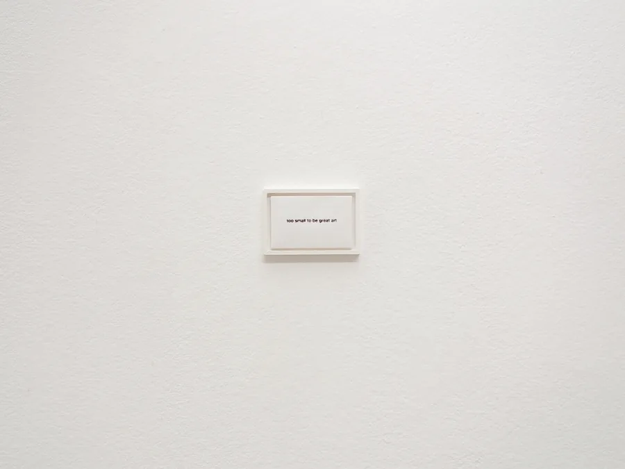 too small to be great art, the tiny frame alone on a large wall