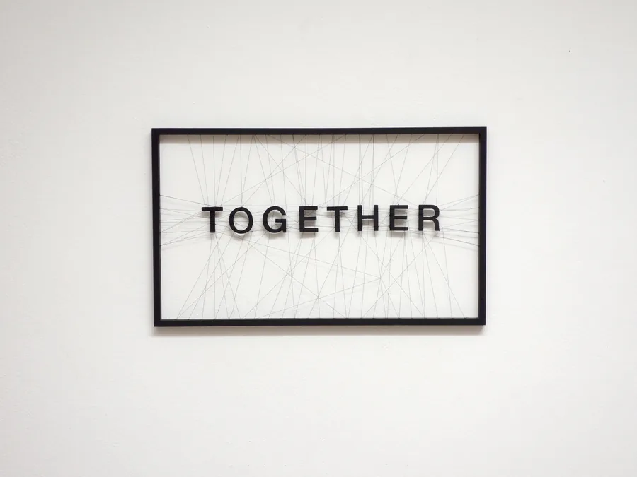together, 30cm x 50cm, wooden letters, thread, wooden frame, ©2021