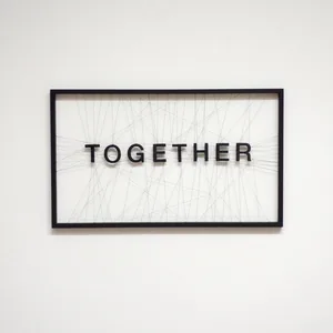 together, 30cm x 50cm, wooden letters, thread, wooden frame, ©2021
