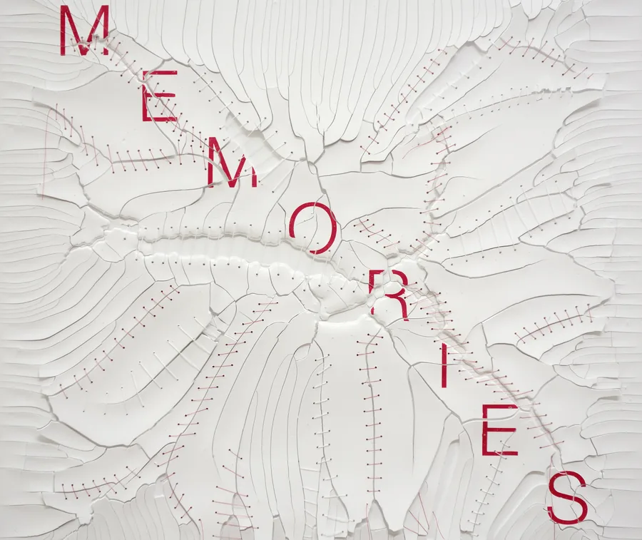 getting older, detail, the word across the stitched surface