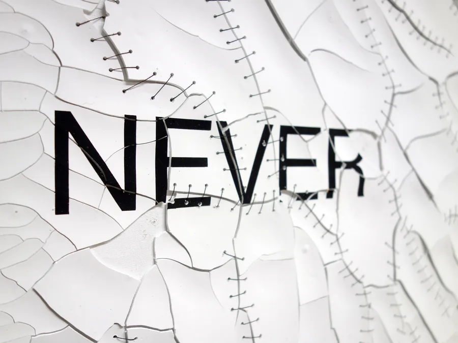 never ending, detail, the word above the stitched cracks