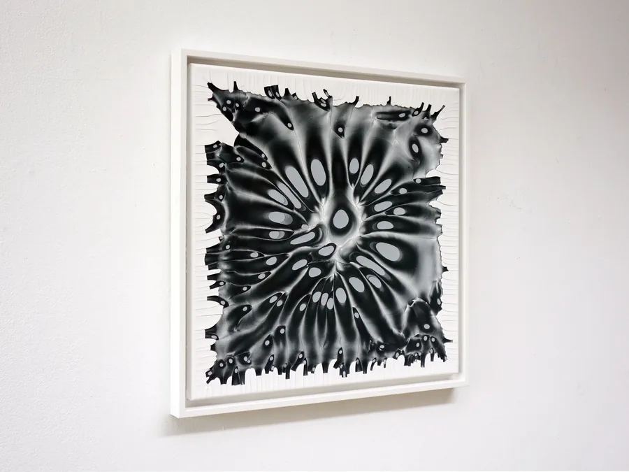 behind the surface, the framed work seen from the side