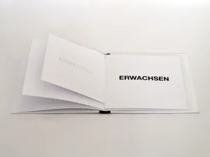 wachsein, the open book with the word erwachsen