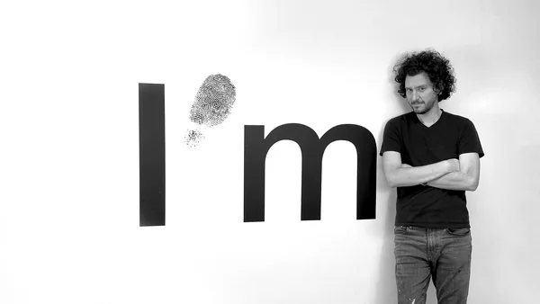 anatol knotek in front of one of his text installations